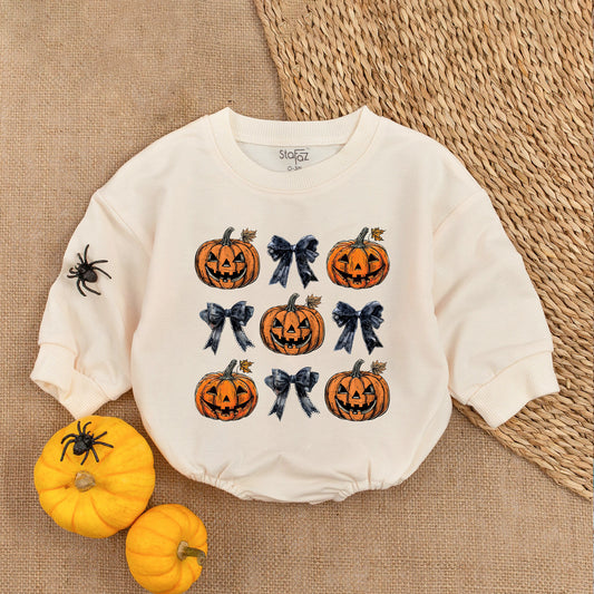 Adorable Retro Halloween Baby Romper featuring smiling jack-o'-lanterns and bows with autumn leaves a sweet first fall celebration outfit