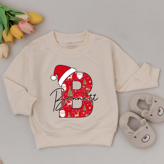 Personalized Baby's 1st Christmas Sweatshirt with Initial B & Santa Hat, Custom Name Bennett, Cute Holiday Outfit, New Baby Gift for Girls 137 chars