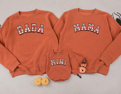 Matching Mama Dada Mini Christmas Plaid Family Sweatshirt Set featuring festive red green tartan lettering for new Mom Dad and Baby's cute holiday outfits.