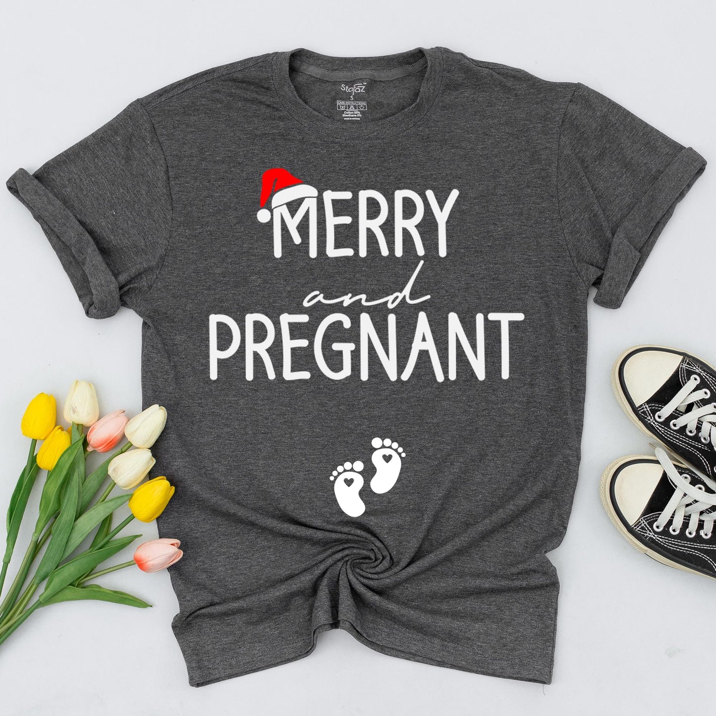 Merry and Pregnant Christmas Maternity Shirt with Santa Hat Design Expecting Mom Gift perfect for a festive pregnancy reveal sweatshirt and comfy holiday sweater.
