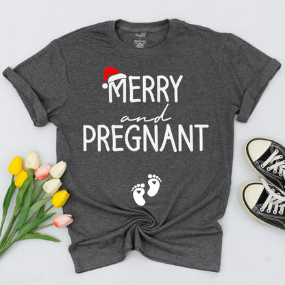 Merry and Pregnant Christmas Maternity Shirt with Santa Hat Design Expecting Mom Gift perfect for a festive pregnancy reveal sweatshirt and comfy holiday sweater.