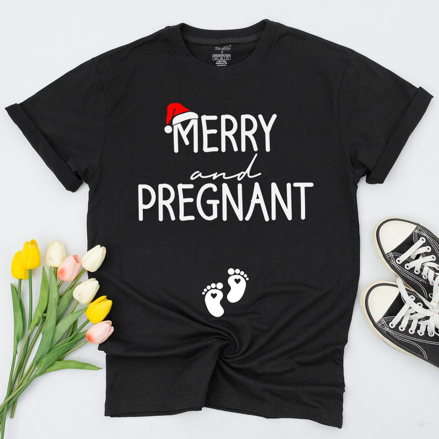 Merry and Pregnant Christmas Maternity Shirt with Santa Hat Design Expecting Mom Gift perfect for a festive pregnancy reveal sweatshirt and comfy holiday sweater.