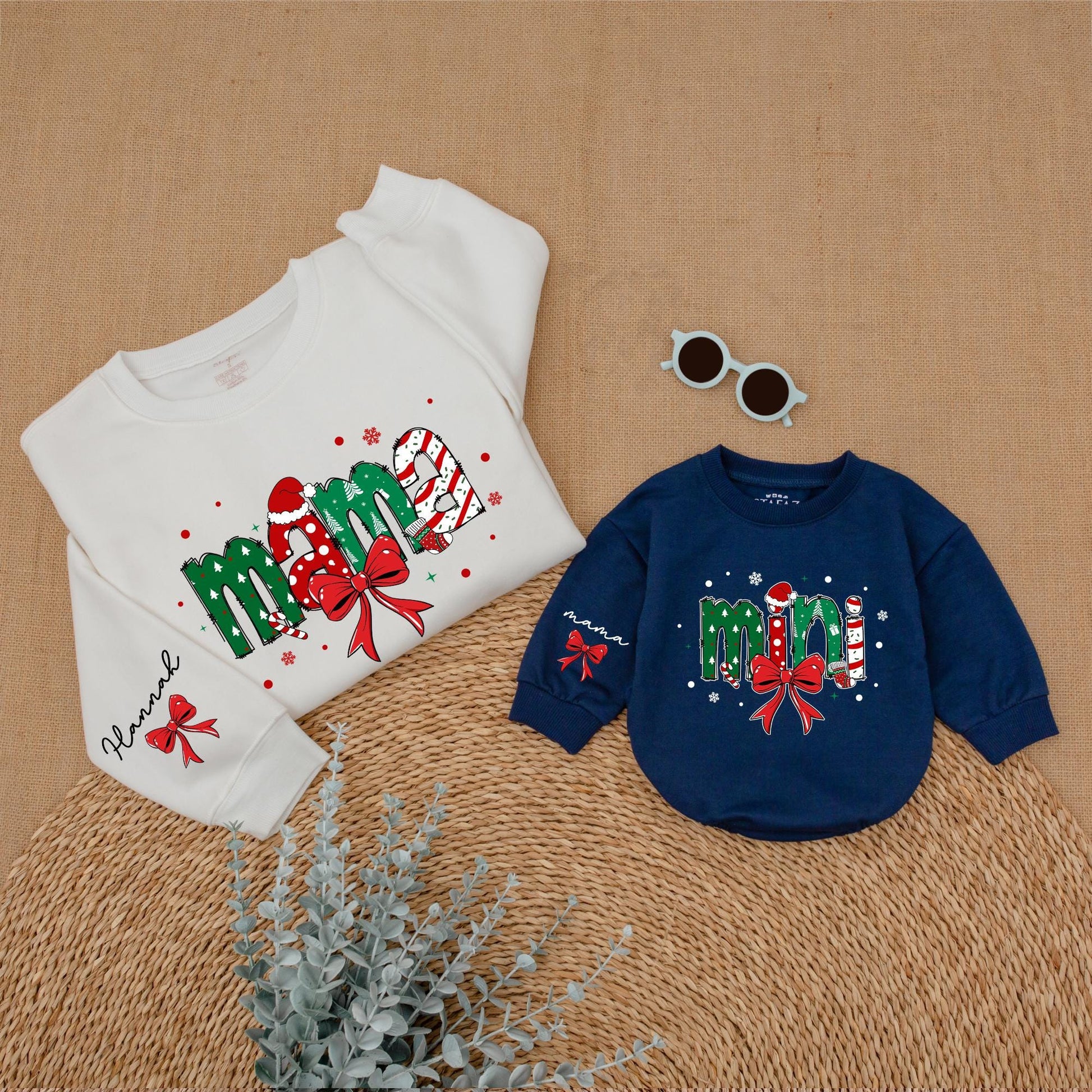 Personalized Christmas Mama Mini Matching Sweatshirt and Baby Romper featuring festive joyful candy cane Santa hat Christmas tree designs and red bows