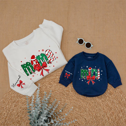 Personalized Christmas Mama Mini Matching Sweatshirt and Baby Romper featuring festive joyful candy cane Santa hat Christmas tree designs and red bows