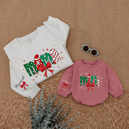 Personalized Christmas Mama Mini Matching Sweatshirt and Baby Romper featuring festive joyful candy cane Santa hat Christmas tree designs and red bows
