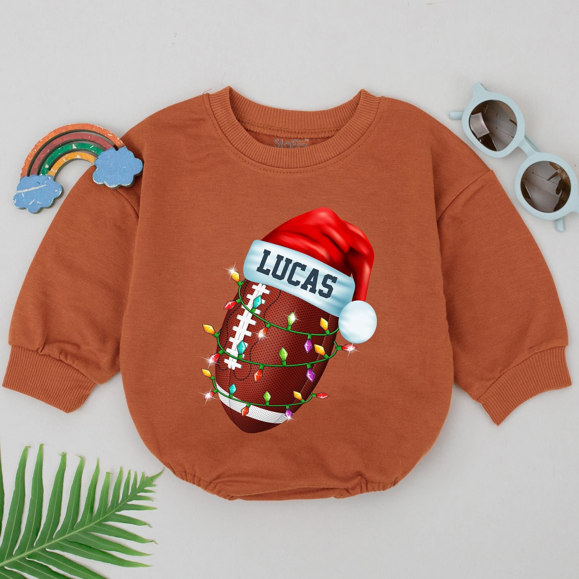 Personalized Baby Boy Football Christmas Romper, First Birthday Outfit with Festive Santa Hat and String Lights Design