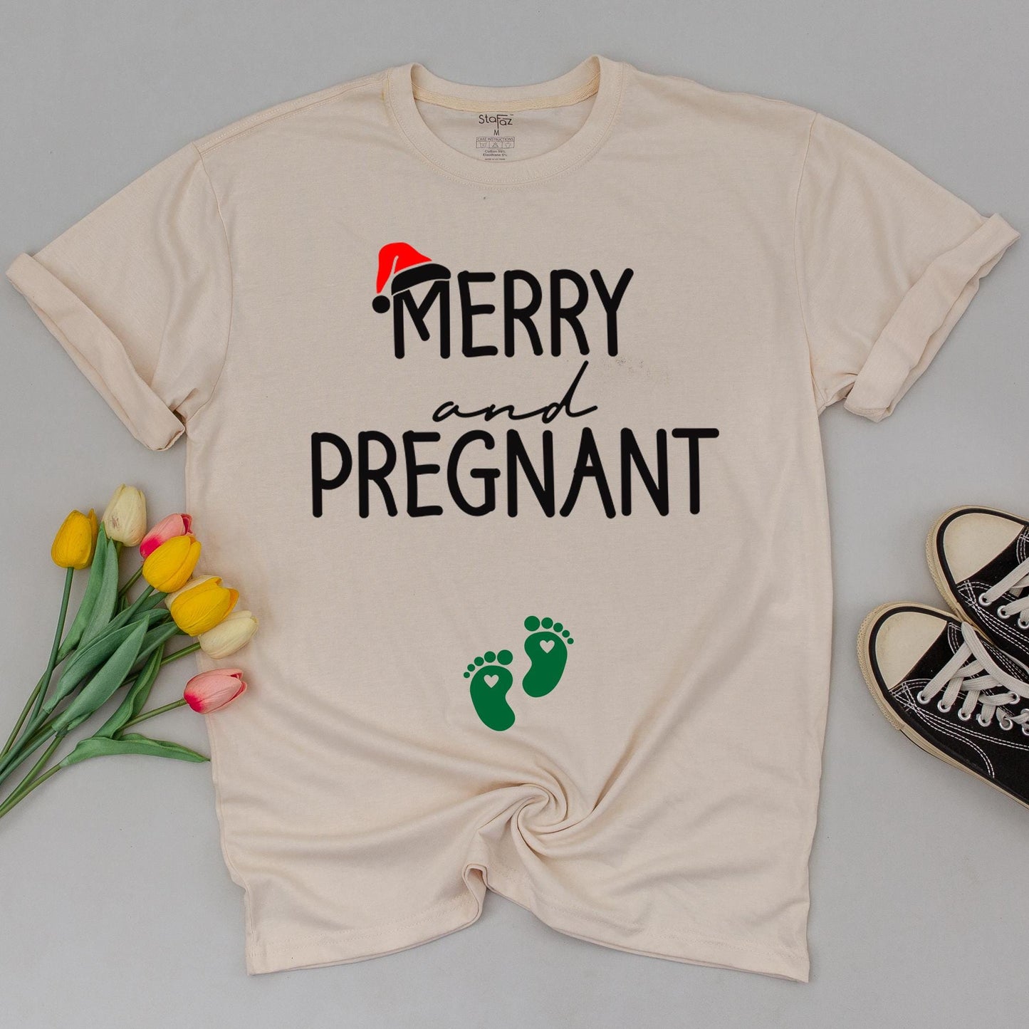 Merry and Pregnant Christmas Maternity Shirt with Santa Hat Design Expecting Mom Gift perfect for a festive pregnancy reveal sweatshirt and comfy holiday sweater.