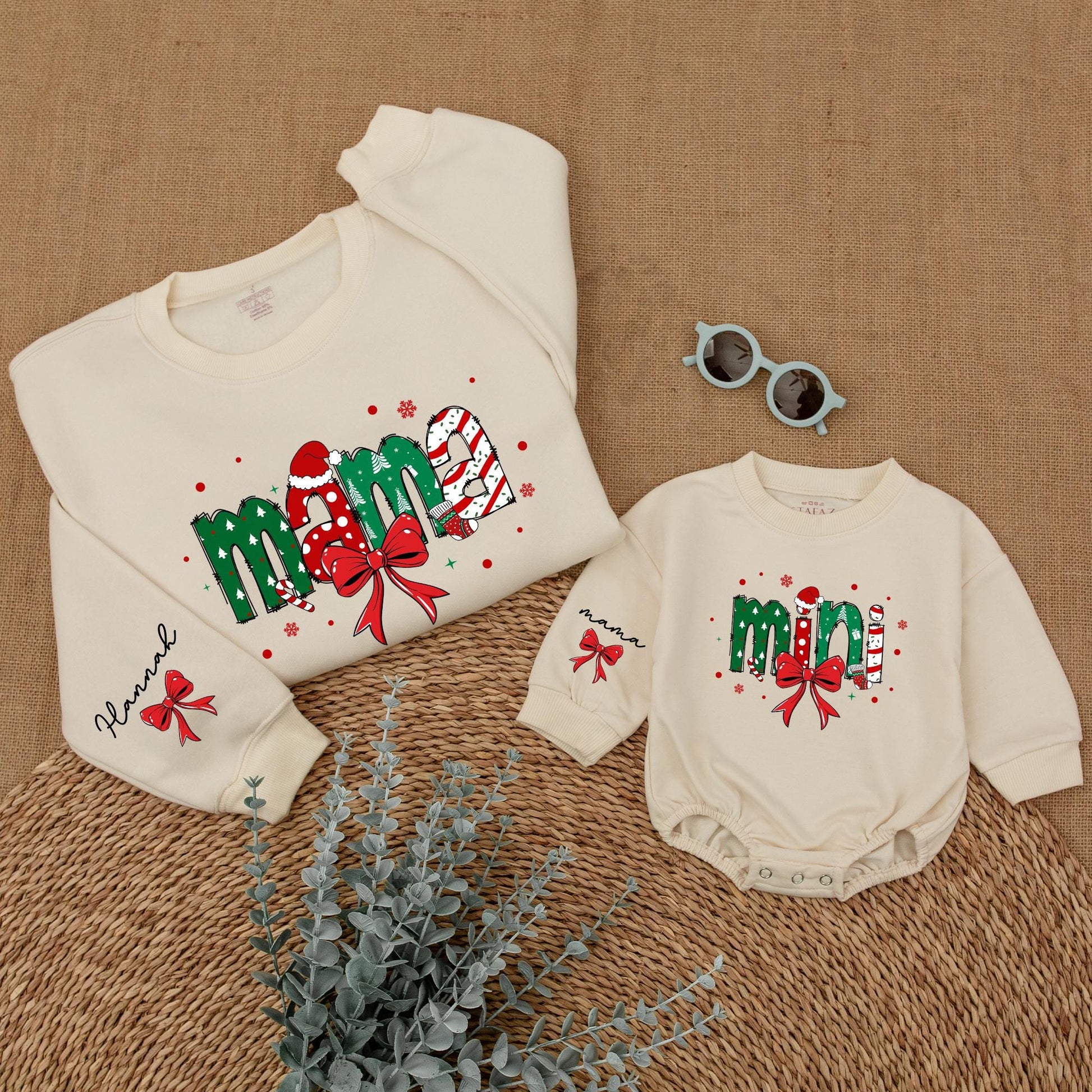 Personalized Christmas Mama Mini Matching Sweatshirt and Baby Romper featuring festive joyful candy cane Santa hat Christmas tree designs and red bows