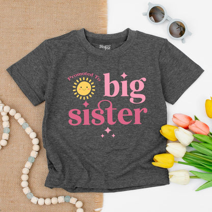 Promoted To Big Sister Toddler T-Shirt Smiling Sun Graphic White Letters Starbursts Cute Announcement Baby Gift