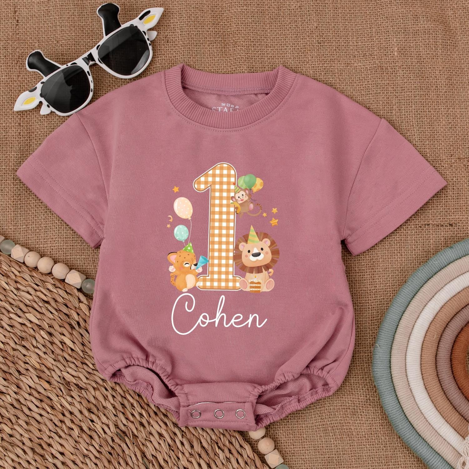 Personalized Safari Wild One Birthday Romper for Baby Boy or Girl Featuring a Gingham '1' and Adorable Safari Animals in Warm Tones, 'Cohen' Cursive Name Detail, Perfect for Zoo Animal First Birthday Celebrations