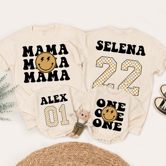 Matching One Happy Dude 1st Birthday Family Shirt Set: Retro Smiley Face Design with Black Fonts, Gold Checkerboard Numbers & Lightning Bolt Eyes (138 chars)