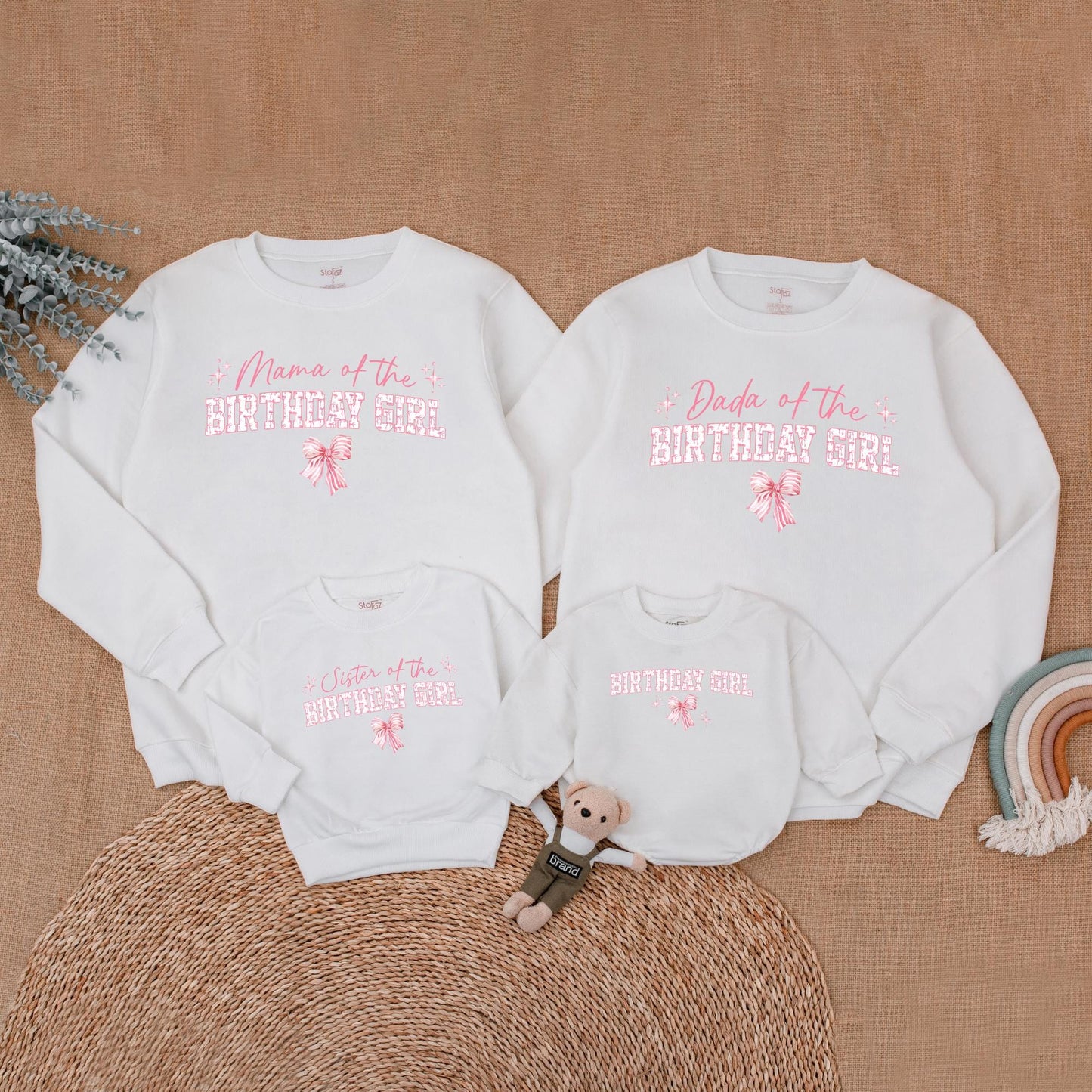 Playful Pink Bow First Birthday Family Matching Outfit Mama Dada Sister Sweatshirt Girl Celebration Sweet Pink Tone Starburst Design