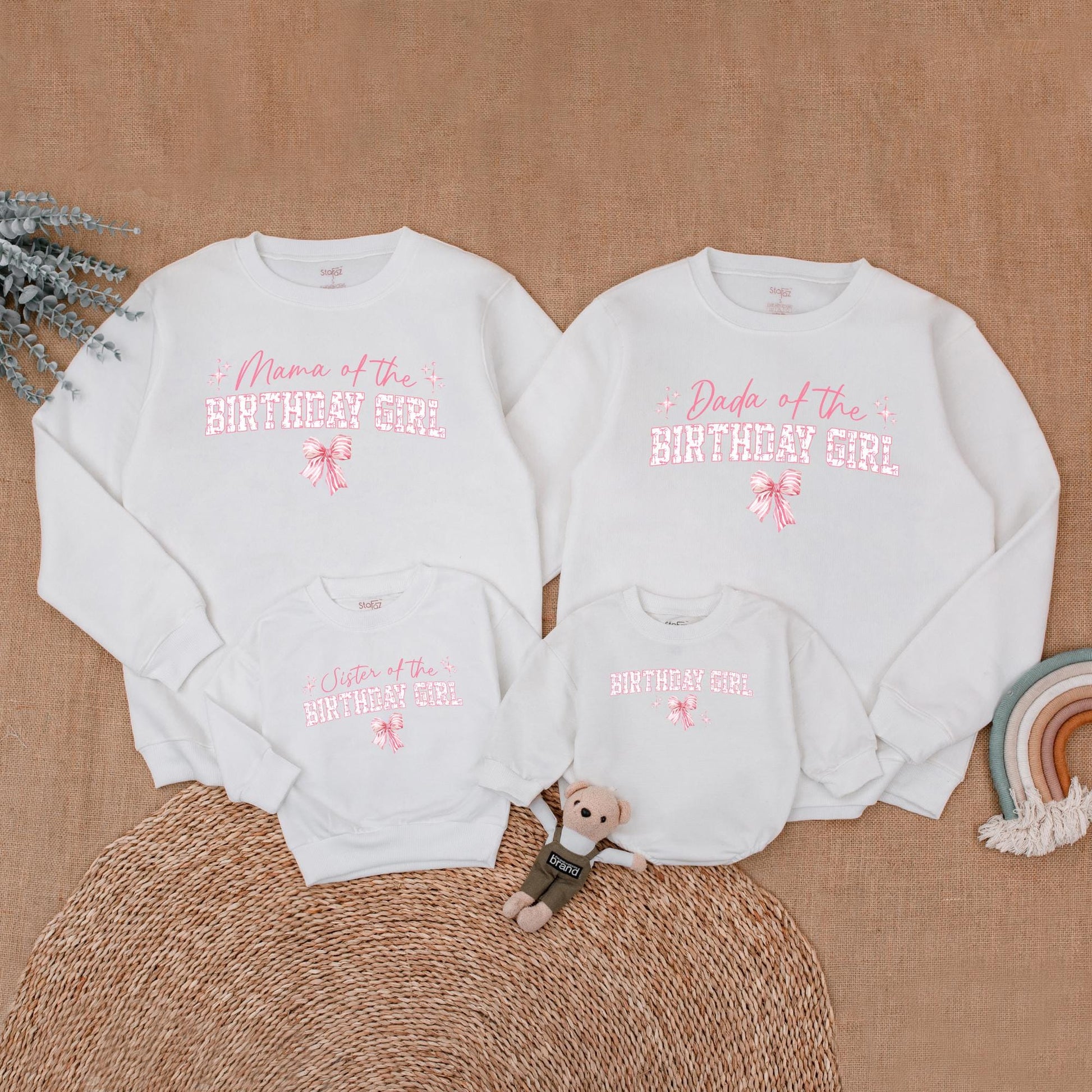 Playful Pink Bow First Birthday Family Matching Outfit Mama Dada Sister Sweatshirt Girl Celebration Sweet Pink Tone Starburst Design
