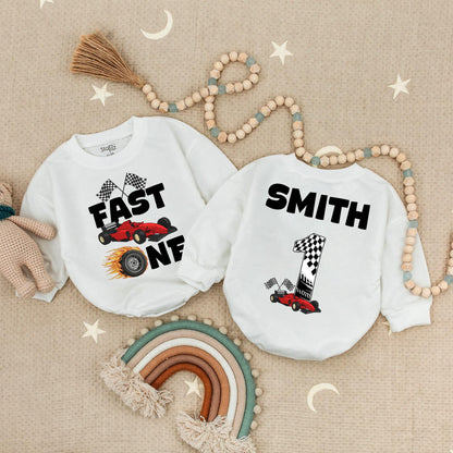 Fast One Racecar Birthday Romper Baby Boy First Birthday Bodysuit Cute Toddler 1st Birthday Outfit with Checkered Flags and Red Car Design