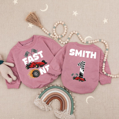 Fast One Racecar Birthday Romper Baby Boy First Birthday Bodysuit Cute Toddler 1st Birthday Outfit with Checkered Flags and Red Car Design