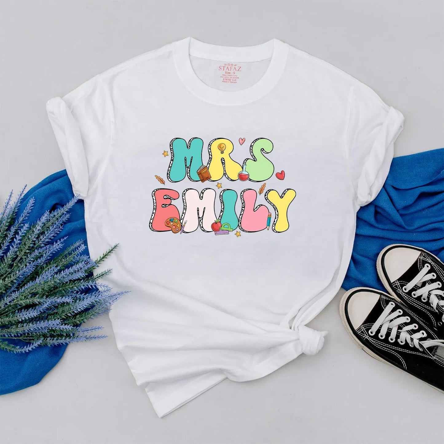 Personalized Teacher Shirt Mrs. Emily Rainbow Name Back to School Outfit, Custom Colorful Letters, Cute Heart Apple Beaker Book Pencil Graphic Gift for Women (138)