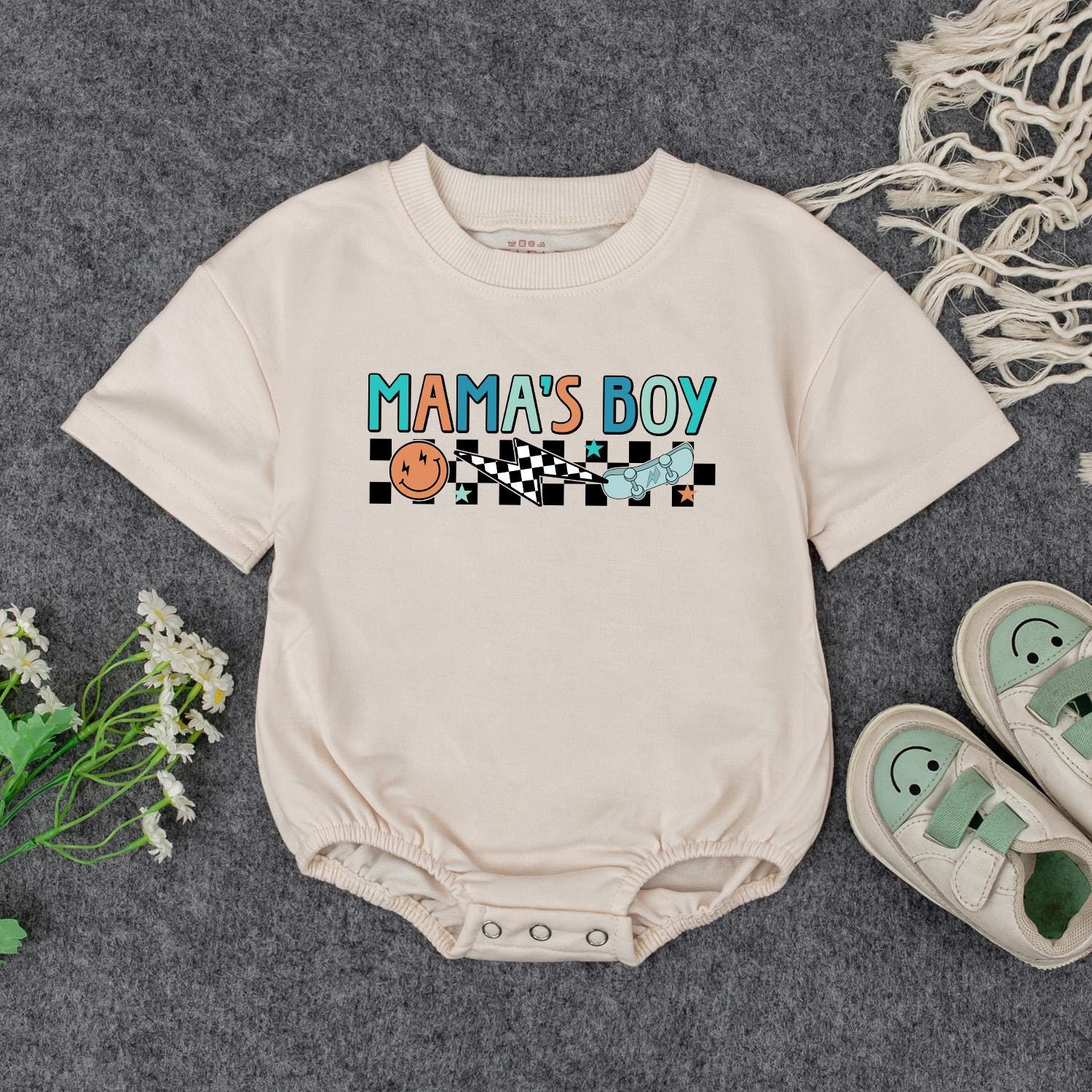 Retro Mama's Boy Romper: Groovy Checkered Bodysuit for Baby Boy, Fun Smiley Face Skateboard Outfit, Soft Cotton Clothes Gift Idea (138 chars)