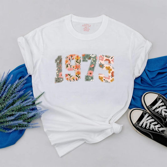 Retro 1975 Birthday Floral Shirt: Custom Year Flower Power Tee for Women, Vintage Style 50th Birthday Gift, Personalized Outfit, Comfortable Cotton (139 chars)