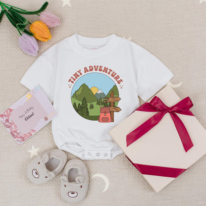 Tiny Adventure Baby Romper Nature Scene with Mountains Pine Trees Sun Snow Cap & Backpack