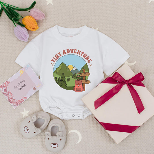 Tiny Adventure Baby Romper Nature Scene with Mountains Pine Trees Sun Snow Cap & Backpack