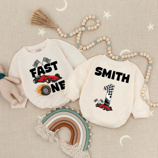 Fast One Racecar Birthday Romper Baby Boy First Birthday Bodysuit Cute Toddler 1st Birthday Outfit with Checkered Flags and Red Car Design
