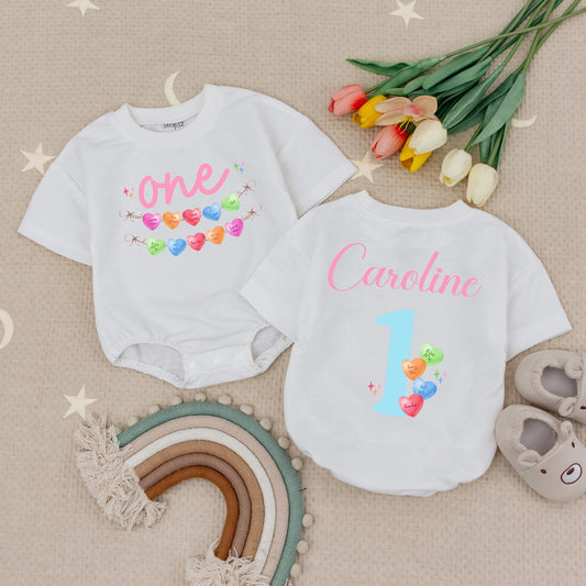 Personalized Candy Hearts First Birthday Romper for Baby Girl with Pastel Love You Be Mine Messages One Year Old Babysuit
