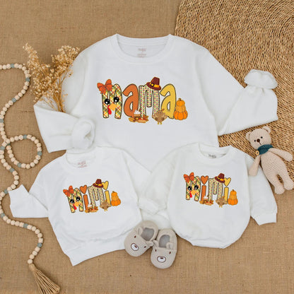 Adorable Mama and Mini Fall Sweatshirts with Playful Pumpkin Turkey Designs Warm Orange Red Colors Perfect for Thanksgiving Family Outings