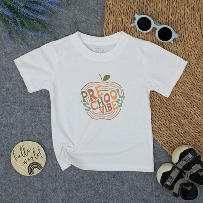 Retro Preschool Vibes Toddler Shirt - Back to School Apple Tee with Wavy Lines - Cute & Comfy for Little Learners (132 characters)