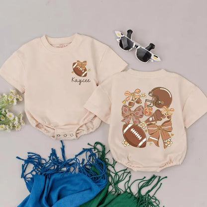 Personalized Game Day Romper: Retro Football Girl Outfit with Name, Bows & Flowers, Vintage-Inspired Baby Shower Gift for Your Little Football Star (139 chars)