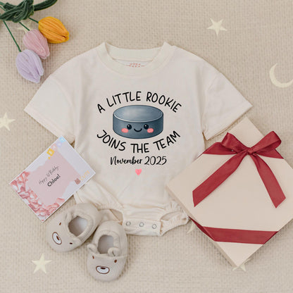 Custom A Little Rookie Joins The Team Hockey Baby Announcement Romper, Baby Reveal Outfit, Hockey Fan Gift, November 2025