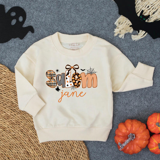 Personalized Spooky Jane Halloween Toddler Girl Sweatshirt with Stylized Letters Ghost Patterns Pumpkins Bats and Spiderwebs Fun Fall Costume