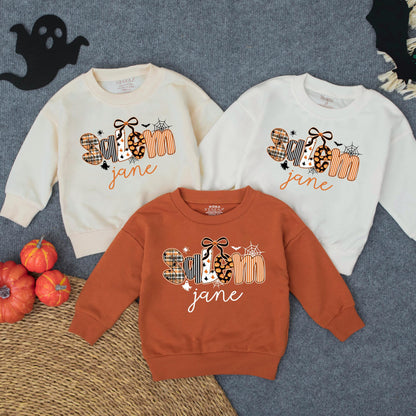 Personalized Spooky Jane Halloween Toddler Girl Sweatshirt with Stylized Letters Ghost Patterns Pumpkins Bats and Spiderwebs Fun Fall Costume