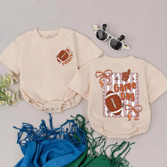 Everlyn's First Game Day Romper: Personalized Football Outfit, Retro Baby Girl Bodysuit & Bow, Tan & Peach, Football Season Baby Shower Gift (139 chars)