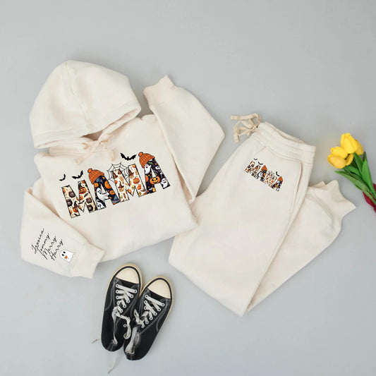 Spooky Season Personalized Mama Sweatshirt: Halloween Ghosts, Bats & Pumpkins Design, Custom Name Sleeve, Festive Mom Hoodie, Comfort & Style, Gift for Her (140)