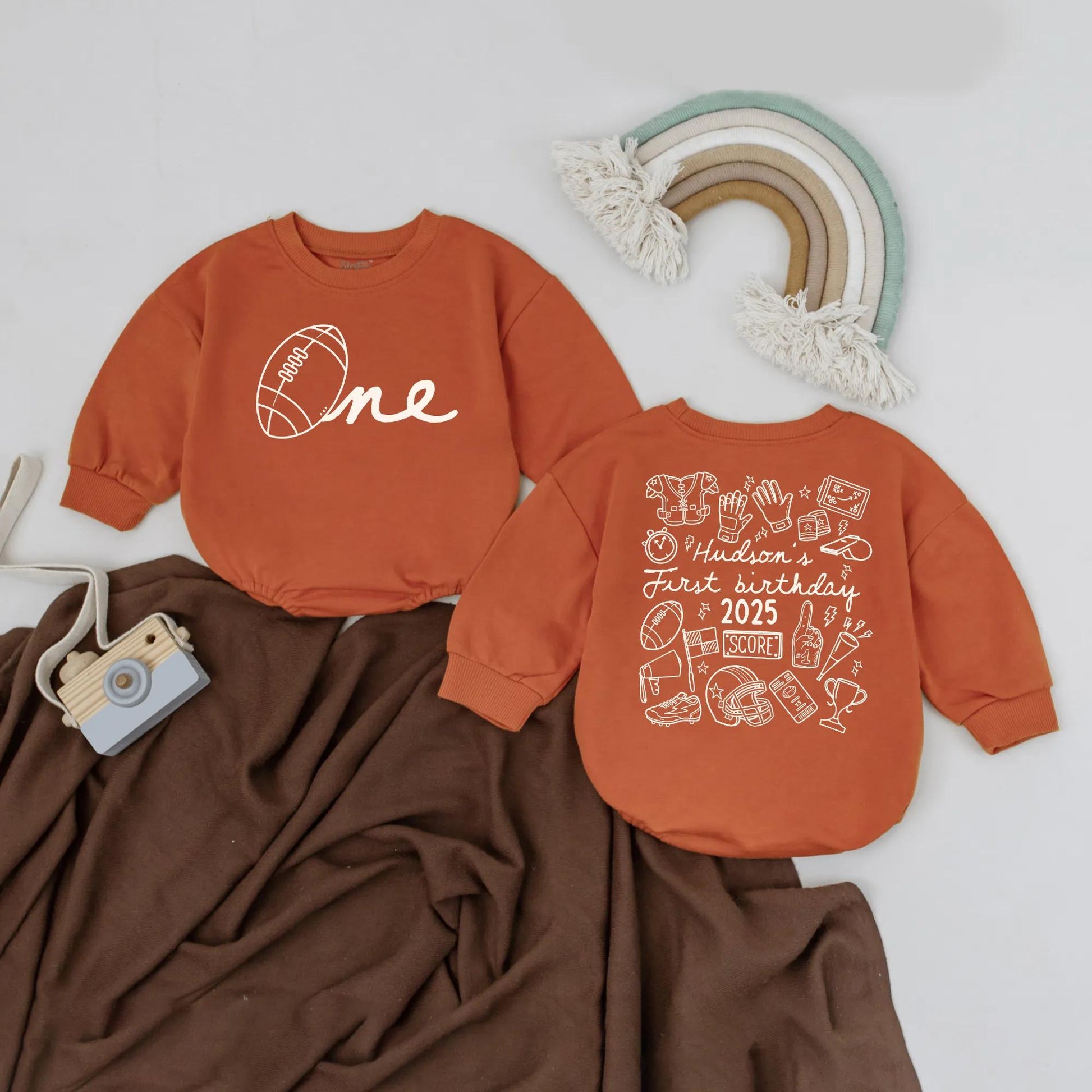 Personalized First Birthday Football Bubble Romper Baby Boy Monochromatic Brown Hand-Drawn Sports One Year Old "One" Design Bodysuit