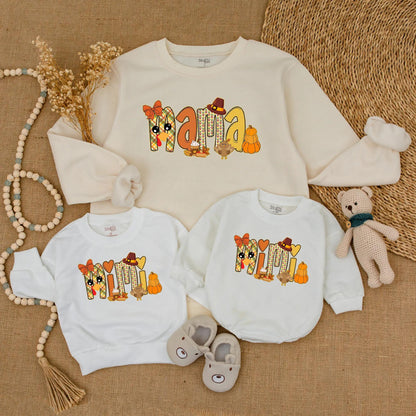 Adorable Mama and Mini Fall Sweatshirts with Playful Pumpkin Turkey Designs Warm Orange Red Colors Perfect for Thanksgiving Family Outings
