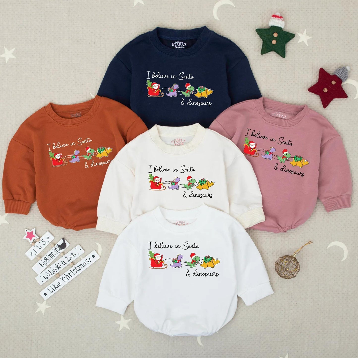 Santa Dinosaur Christmas Romper: I Believe! Funny Toddler Holiday Sweatshirt, Colorful Cartoon Santa Sleigh with Purple, Green & Yellow Dinos Gift Idea (138 chars)
