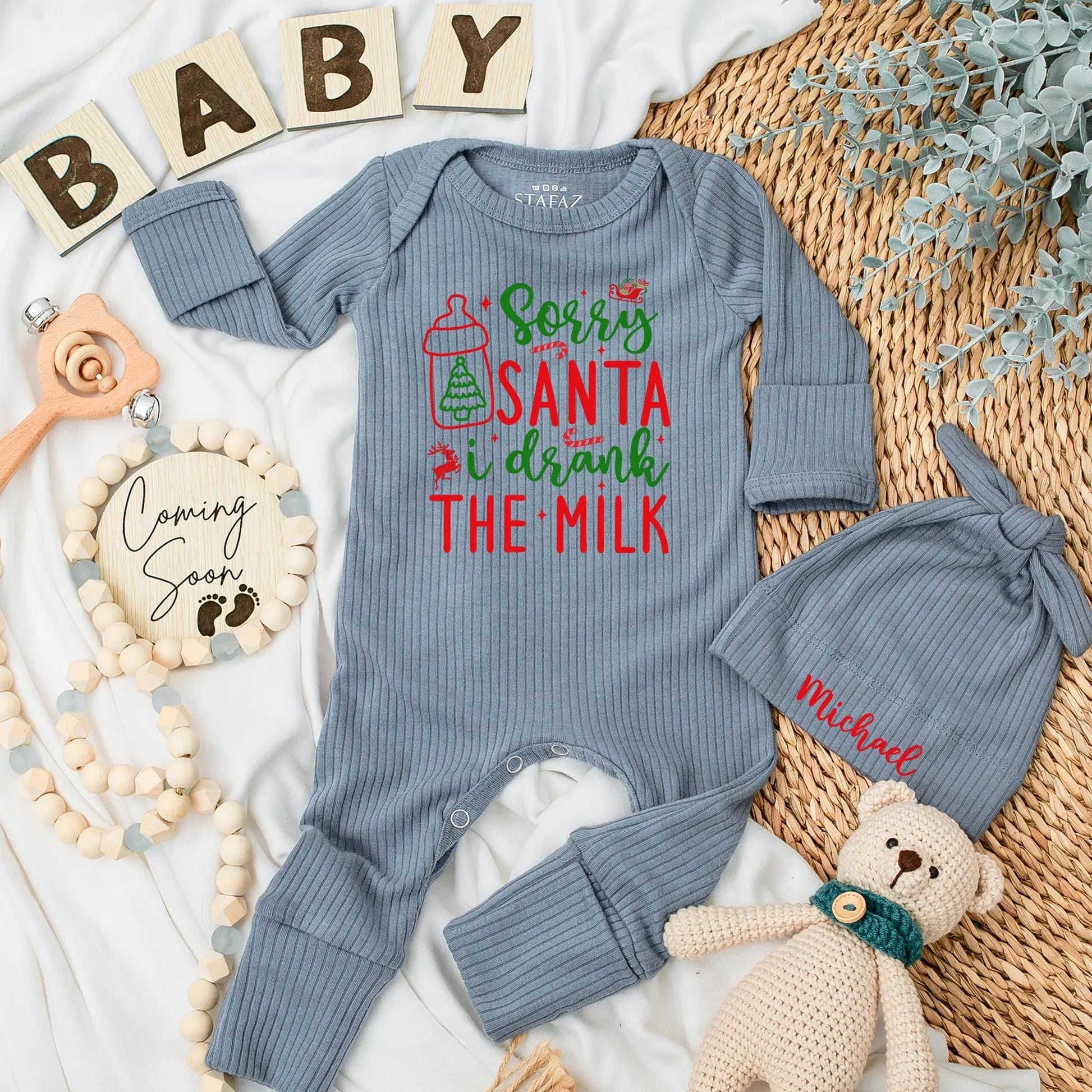 Sorry Santa I Drank The Milk Baby Bodysuit funny Christmas newborn outfit, festive red green design with sleigh reindeer stars and playful script for a baby's first holiday gift.