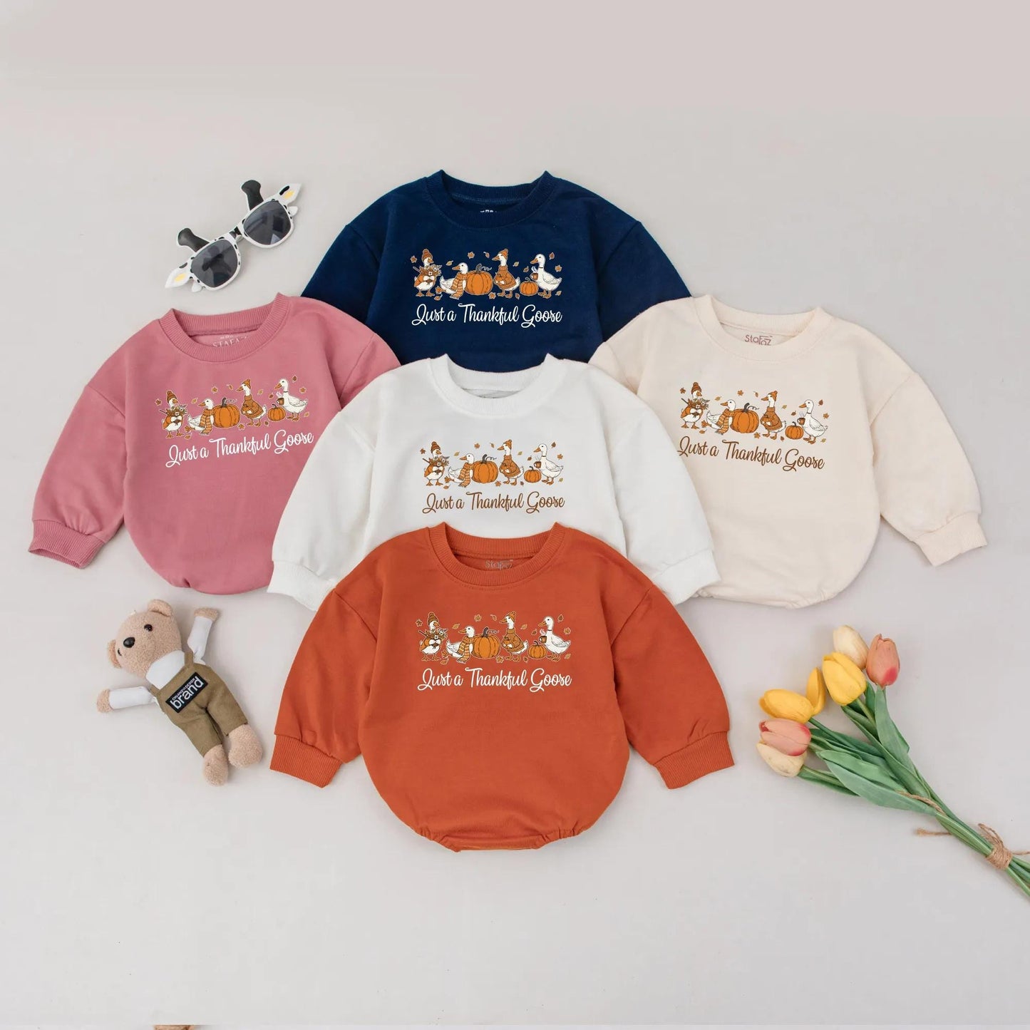 Just a Thankful Goose Baby Bubble Romper, charming Fall geese, pumpkins, and autumn leaves, a cozy Thanksgiving outfit for newborns.