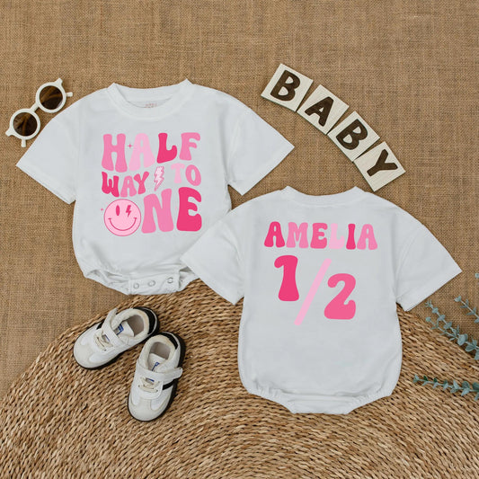 Personalized Pink Half Way to One Baby Girl Romper with Custom Name, Playful Smiley Face Lightning Bolt 6 Month Milestone Bubble Bodysuit