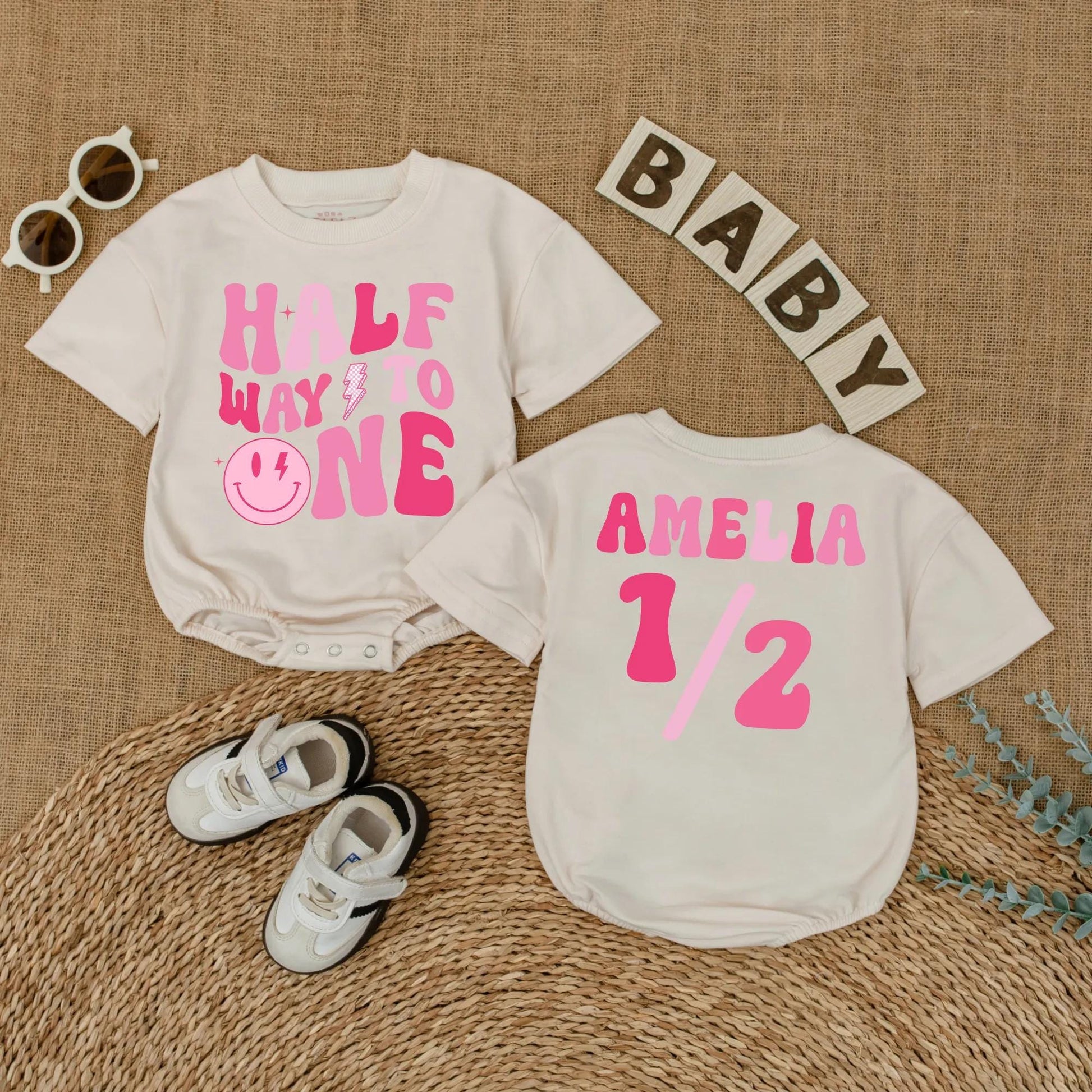 Personalized Pink Half Way to One Baby Girl Romper with Custom Name, Playful Smiley Face Lightning Bolt 6 Month Milestone Bubble Bodysuit