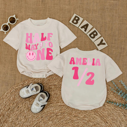 Personalized Pink Half Way to One Baby Girl Romper with Custom Name, Playful Smiley Face Lightning Bolt 6 Month Milestone Bubble Bodysuit