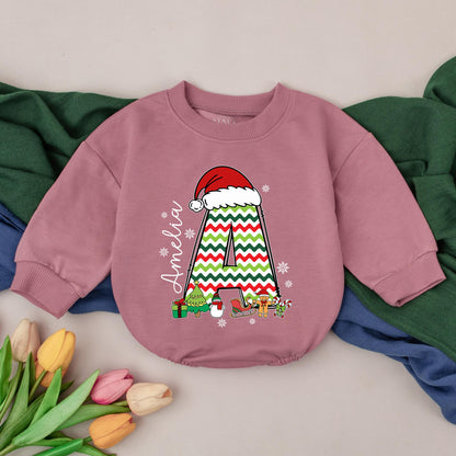 Personalized Name Baby Girl Christmas Bubble Romper featuring a cute Santa hat, zigzag 'A' and fun festive winter characters perfect for a holiday newborn gift