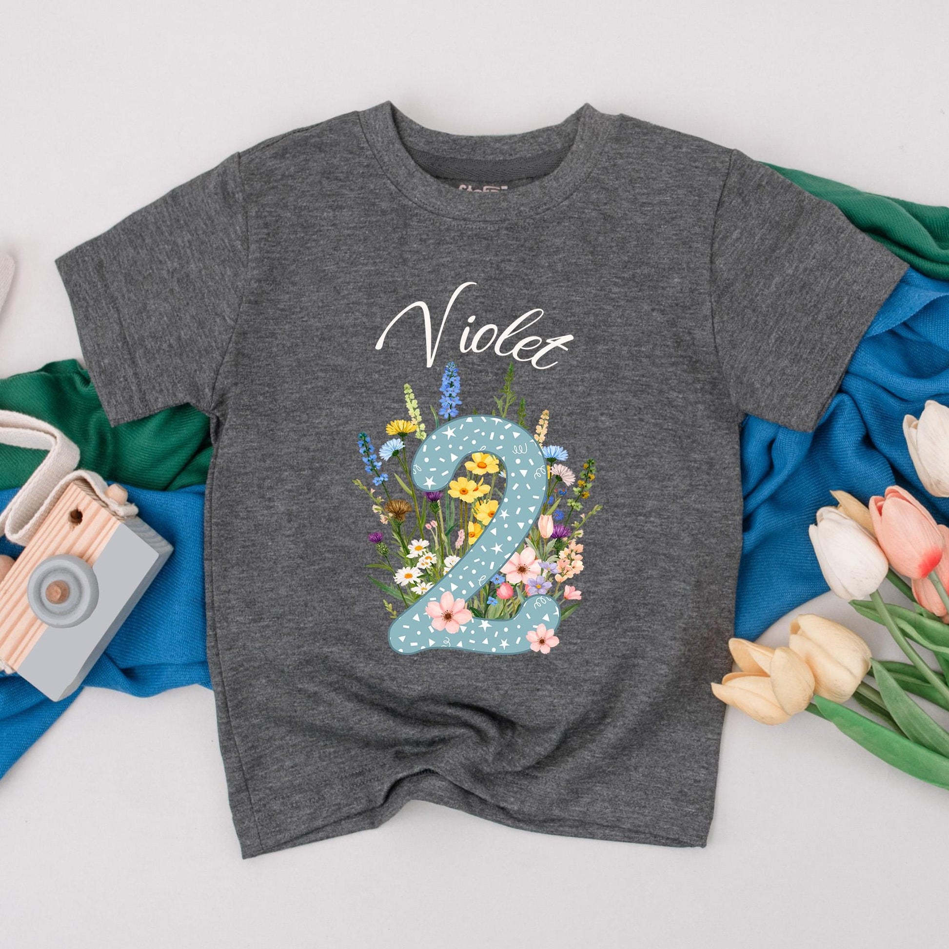 Personalized Violet Wildflower Two Birthday T-Shirt for Girls, Floral 2nd Birthday Party Toddler Outfit with Starry Blue Number 2 and Whimsical Blooms Cotton Comfortable Gift Idea