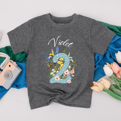 Personalized Violet Wildflower Two Birthday T-Shirt for Girls, Floral 2nd Birthday Party Toddler Outfit with Starry Blue Number 2 and Whimsical Blooms Cotton Comfortable Gift Idea