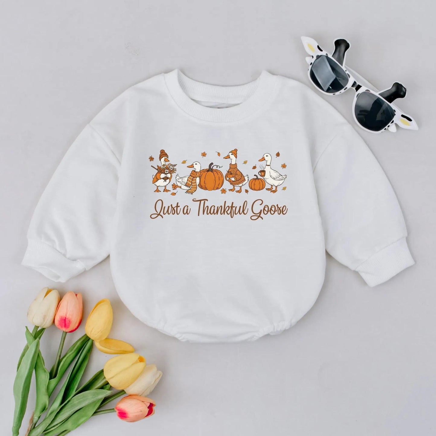 Just a Thankful Goose Baby Bubble Romper, charming Fall geese, pumpkins, and autumn leaves, a cozy Thanksgiving outfit for newborns.