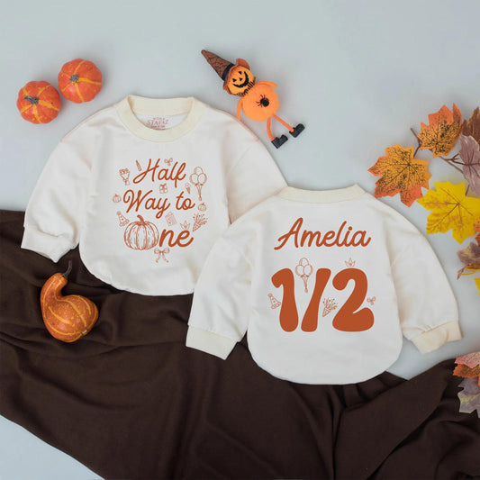 Personalized Half Way to One Pumpkin Bubble Romper with warm orange fall graphics festive half birthday celebration outfit for baby girl boy