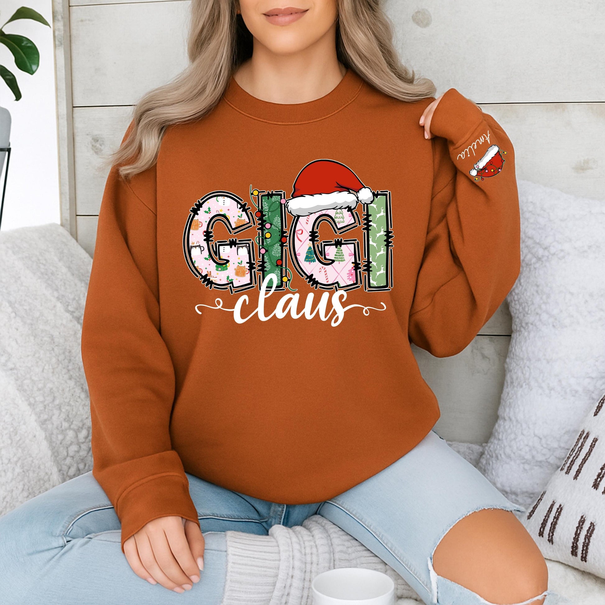 Personalized Gigi Claus Christmas Sweatshirt with Grandkids Names on Sleeve featuring festive patterned pink green white graphics comfy gift