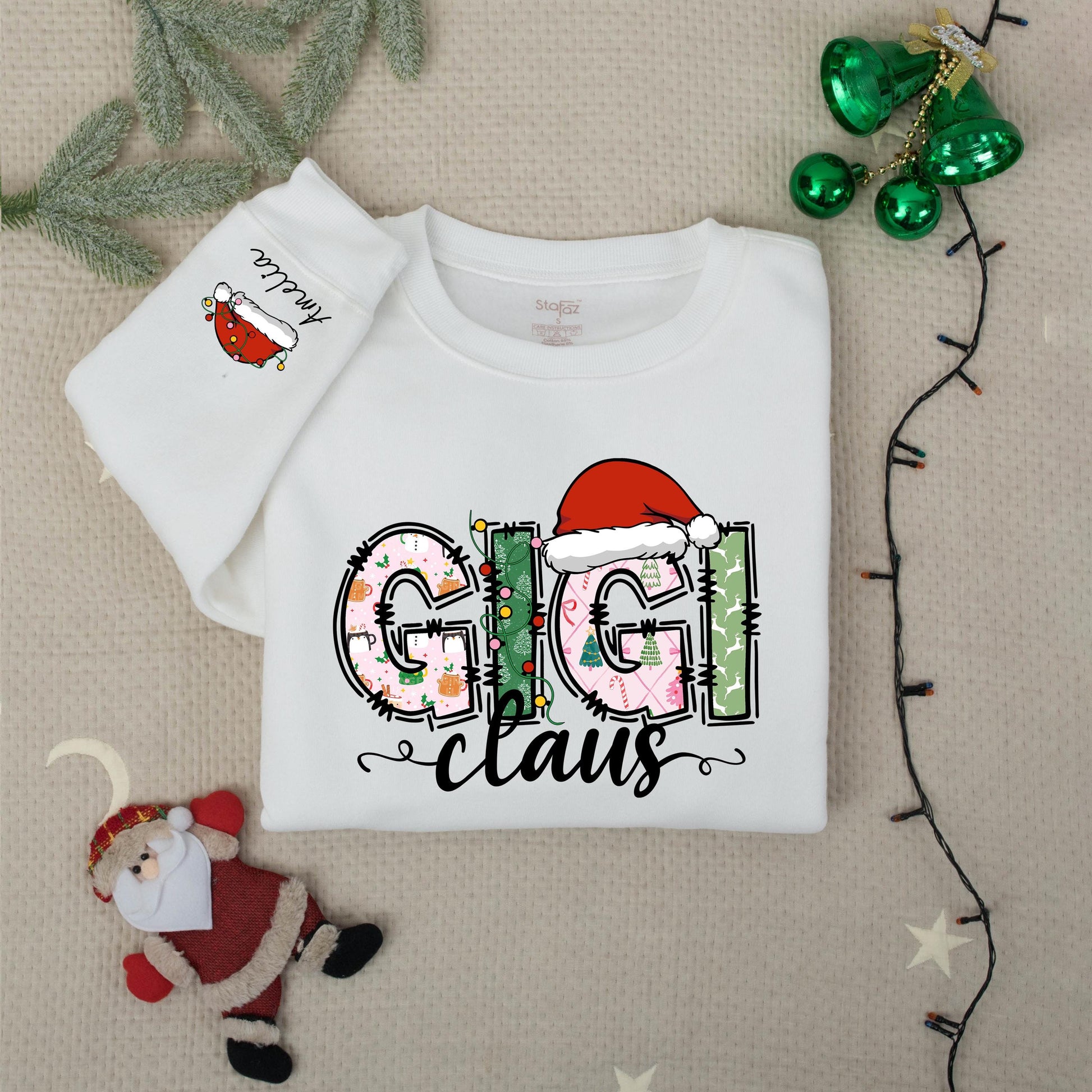 Personalized Gigi Claus Christmas Sweatshirt with Grandkids Names on Sleeve featuring festive patterned pink green white graphics comfy gift