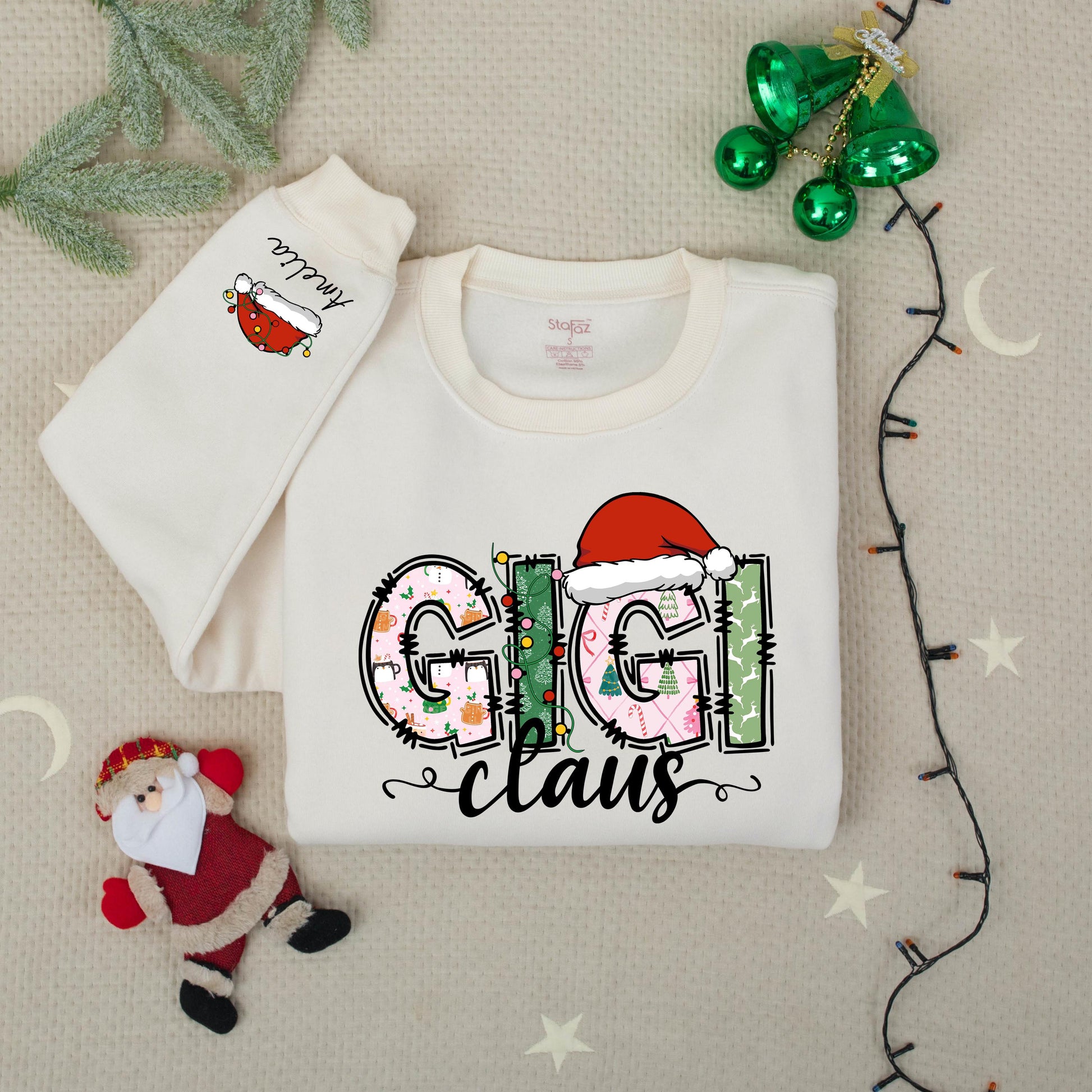 Personalized Gigi Claus Christmas Sweatshirt with Grandkids Names on Sleeve featuring festive patterned pink green white graphics comfy gift
